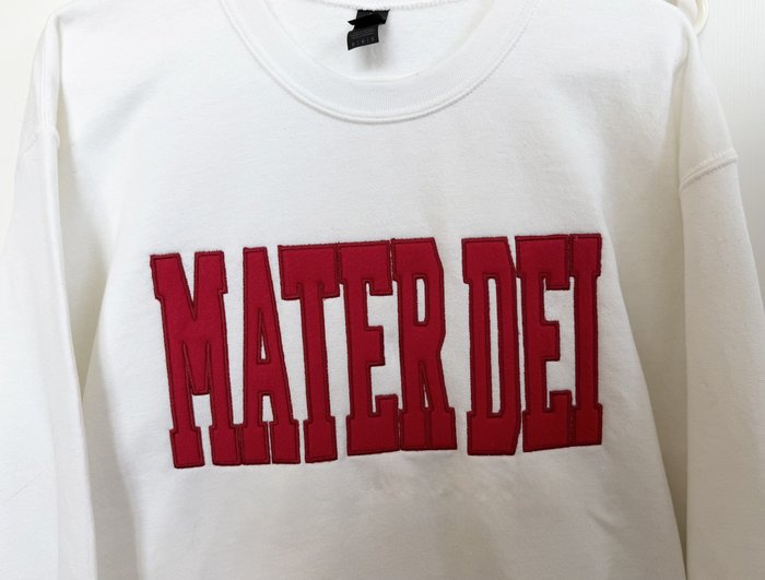 Mater Dei — Red felt appliqué on white crewneck