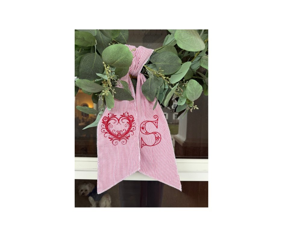 Red seersucker wreath sash with filigree heart and S monogram