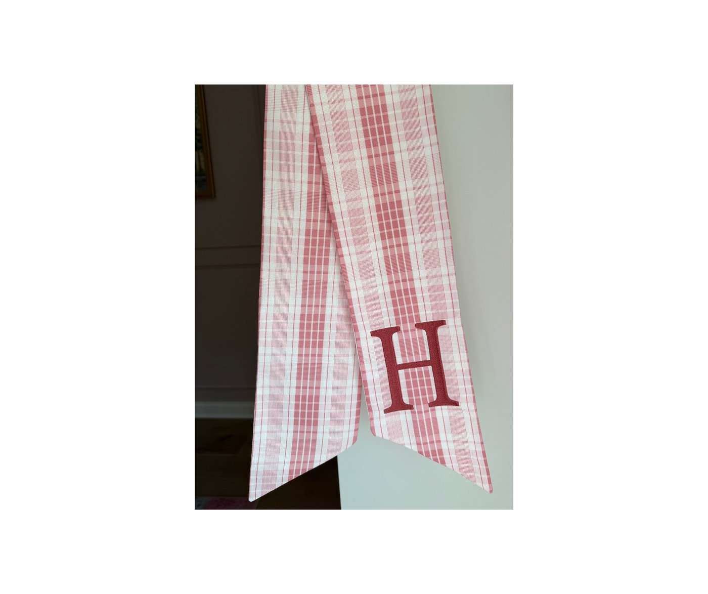 Pink plaid wreath sash with deep red serif H monogram